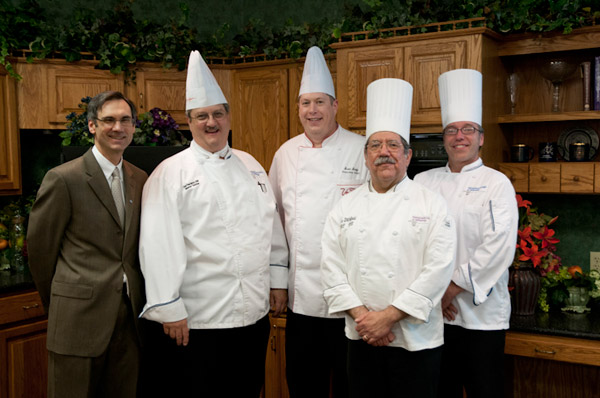 Alumnus and Visiting Chef Scott Endy, center, gathers with School of Hospitality dean Fred Becker and some of his former chef/instructors, assistant professor Paul Mach, instructor Mike Ditchfield and associate professor Craig Cian.
