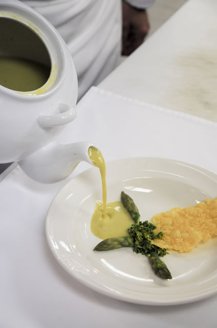 The soup course  featuring young asparagus, lemon gremolata and Parmesan frico