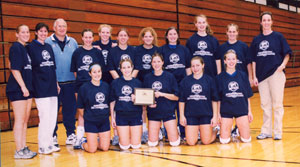 Posing for a volleyball team photo are, back row from left, Liz Mast, Penn College Head Coach Bambi Hawkins, Penn State Head Coach Russ Rose, Annie Allton, Courtney Eisenhofer, Sara Gamble, Cara Vito, Amber Geckle, Janell Thompson, Emily Weaver, and Penn College Assistant Coach Michelle Bower. Front row from left are Melani Grady, Maria Bova, Erin Pillar, Maria McNett and Natalie Plavi. (Photo by Jerry W. McNett, General Services horticulturist - and Maria's father)