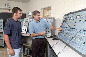 Jacob Vough, left, meets with Kenneth C. Kuhns, assistant professor of electrical technology%2Foccupations, in this 2001 photo. 