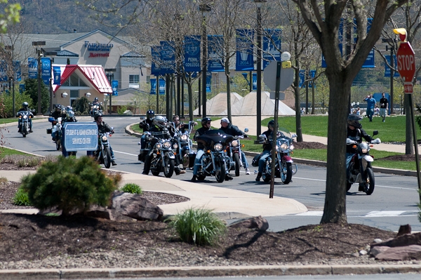 Motorcyclists re-enter main campus after a 42-mile ride to benefit Camp Victory