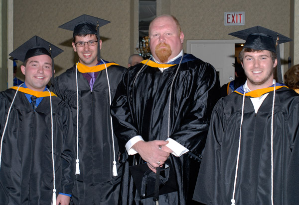Welding instructor Dave R. Cotner, second from right, with (from left) baccalaureate students Nicholas A. Anderson  recipient of the President's Award for leadership and service  Robert John Forbes and Ryan Patrick McCollum.