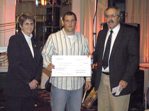 Combining for %244,000 in additional donations to Pennsylvania College of Technology construction students are Melody Harrison from the West Branch Susquehanna Builders Association, and Steven S. Sechrist , center, outgoing WBSBA president, gathering with Tom F. Gregory, the college's dean of construction and design technologies.