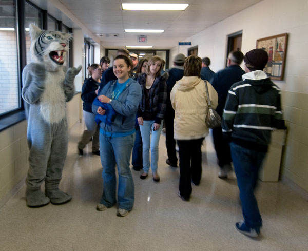 The college's Wildcat mascot makes friends near the Susquehanna Room.