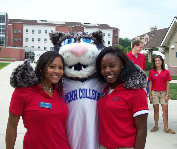 The Wildcat easily makes friends with RAs Kayla E. Bosley, left, and Amanda A. Allanah. In the background are Residence Life colleagues Robert J. Lamb and Ashley G. Maietta.