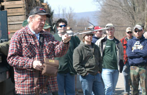 Donald R. Nibert shows students how to track the collared bird via a wireless antenna.