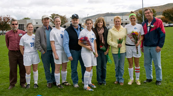 Gathered for women's soccer "Senior Day" are, from left, Brittany Van Gilder (31), with her father, Kimmer; Alicia Cave (9), with her father, Terry; Katie Moltz (32), with parents Toby and Cindy; and Juliette Yeager, with parents Marsha Waldman and David Yeager. Teams in all of Penn College's varsity sports pause during their respective seasons to honor graduating members.