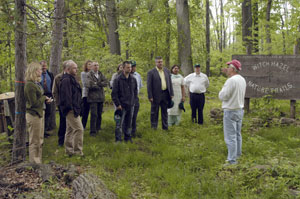 An international group of hardwood buyers listens to Dennis F. Ringling, professor of forestry at Pennsylvania College of Technology, during a recent visit to the Schneebeli Earth Science Center near Allenwood.