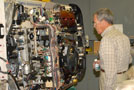 John Irwin, Class of '58, examines a panel in an automotive lab.