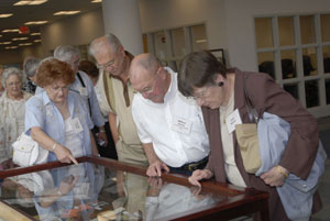 Displays of mementos, many of them donated by alumni, were set up around the library.