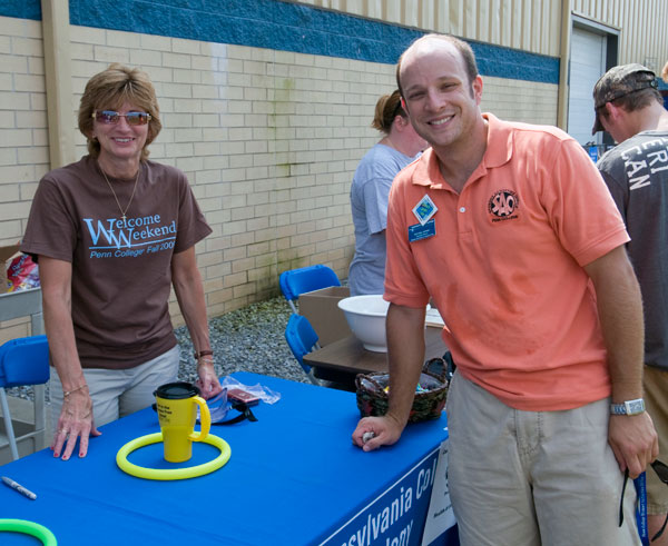 Leann M. Ritter, college nurse, and Michael H. Hersh, assistant director of student activities for programming, are among the friendly faces that greeted students.