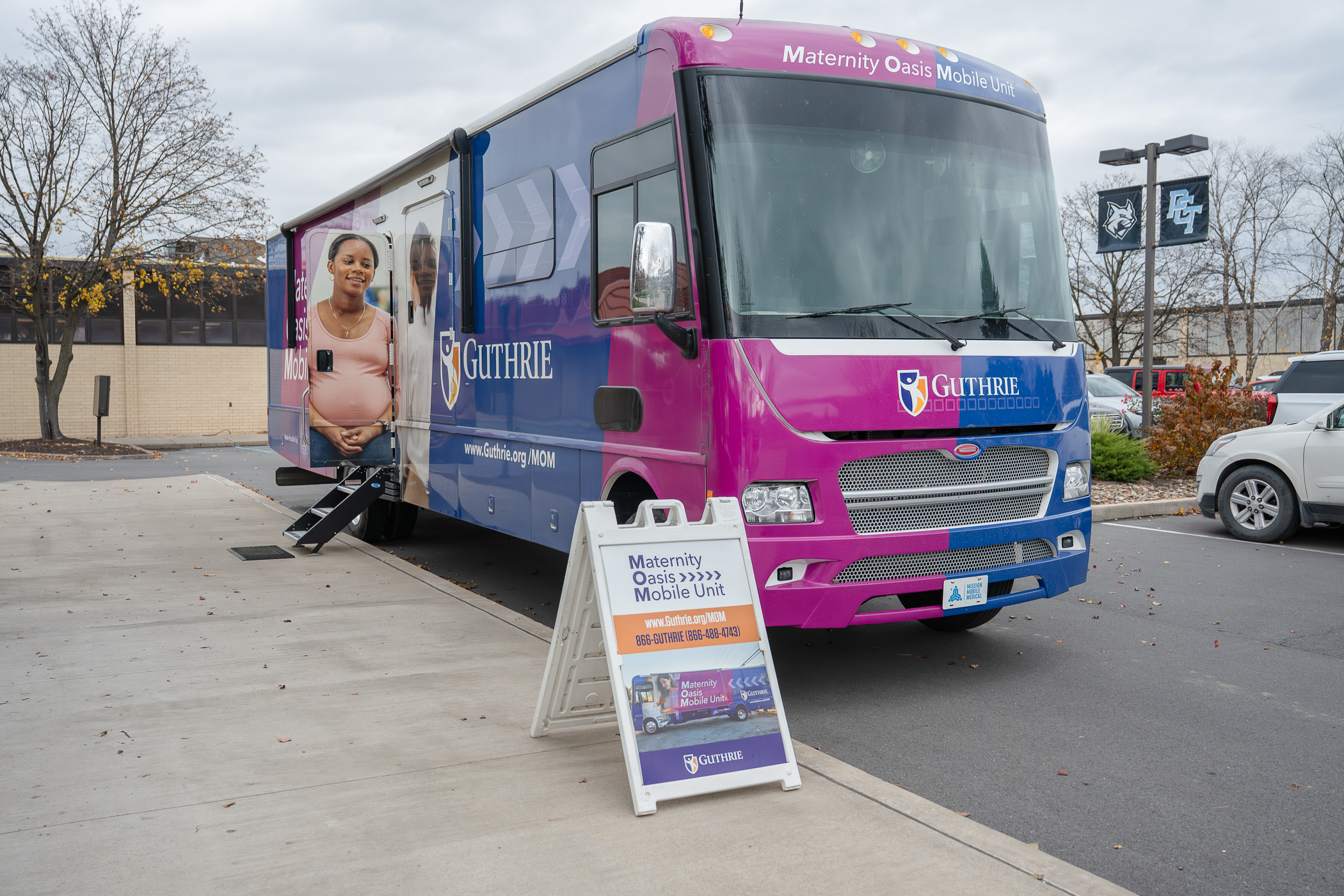 A large vehicle reads "Maternity Oasis Mobile Unit."