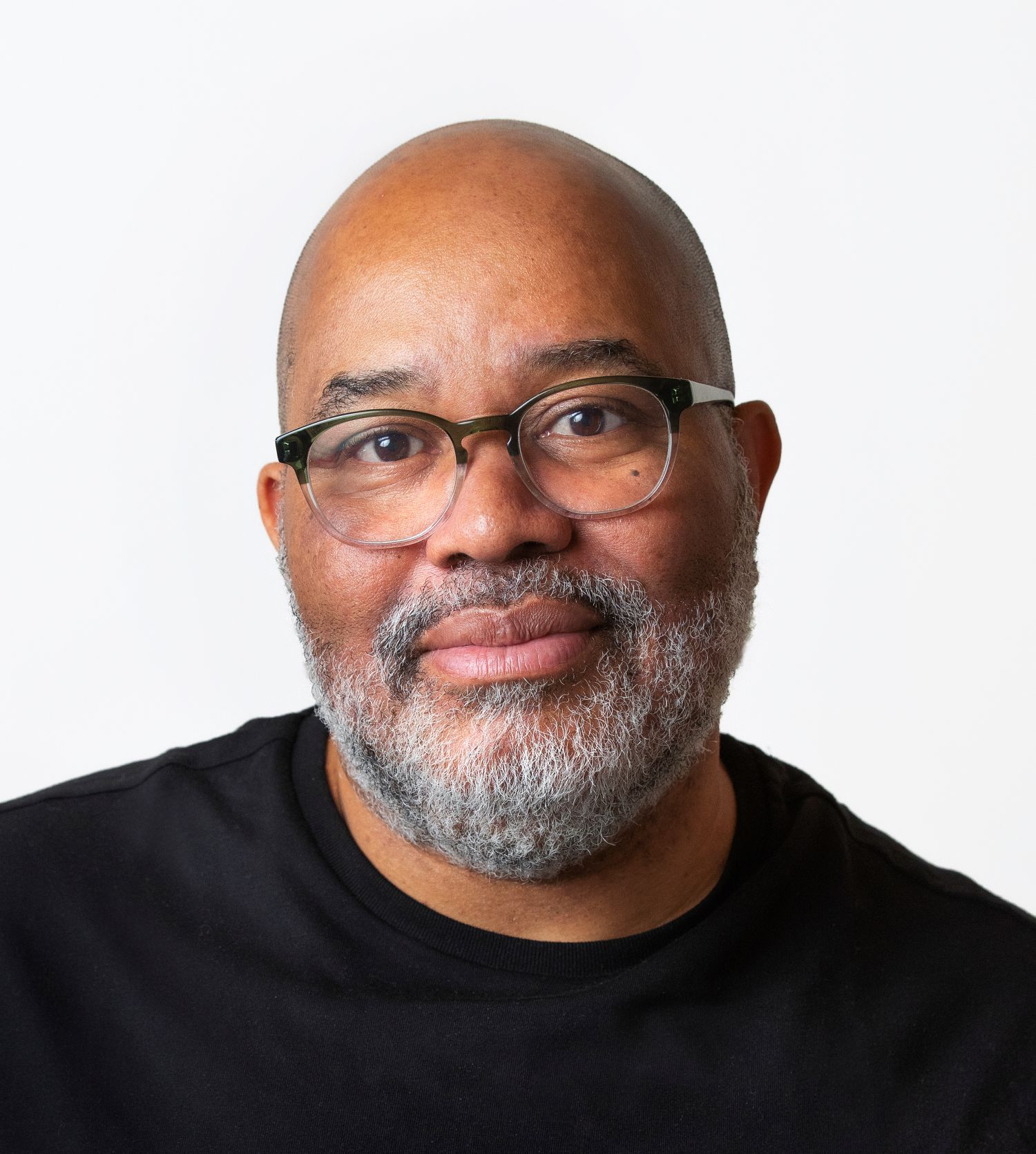 Image of a man wearing glasses and a beard