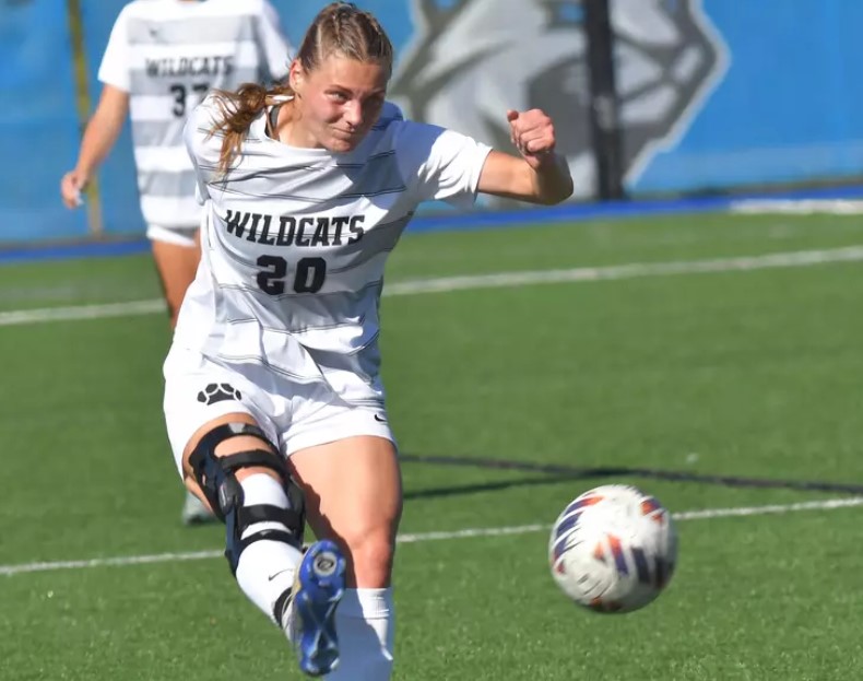 Sarah Darlington kicks a soccer ball.