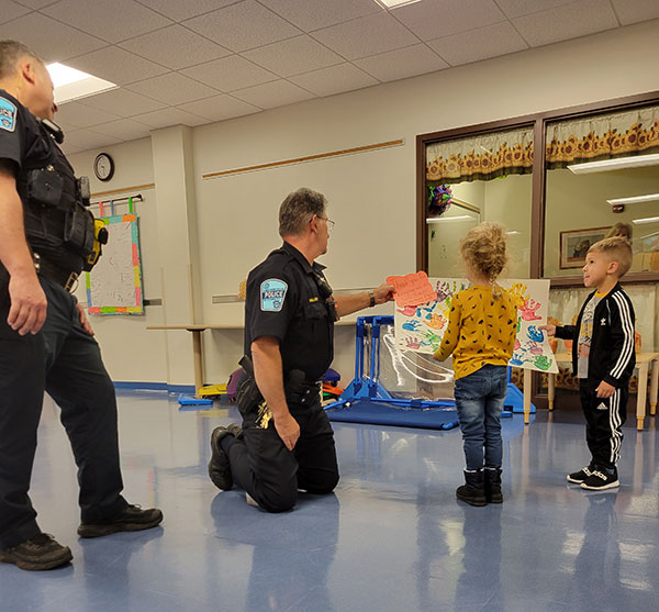 Children's show of hands expresses appreciation for police