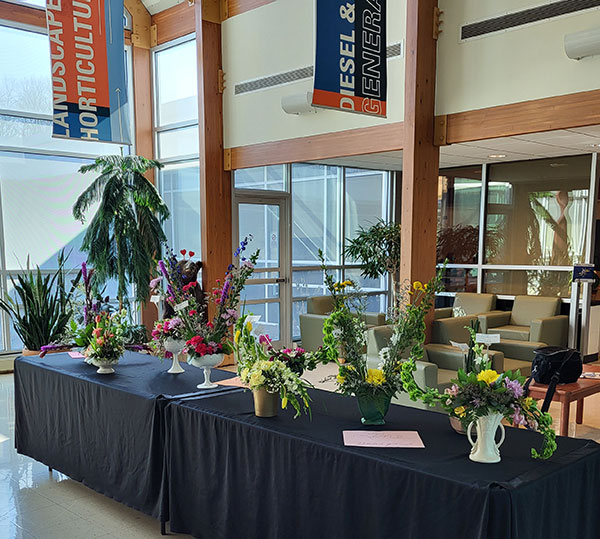 Students' artful floral designs brighten ESC lobby