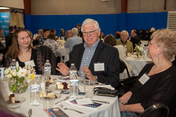 Jeffrey L. Erdly (center), a supporter of two scholarships and a 2004 recipient of Penn College's Distinguished Alumnus Award, enjoys conversation at his table with fellow guest Beth Myers (right), and Elaina M. Lawson, an architecture & sustainable design student from Erie. Erdly, a nationally renowned authority on masonry preservation technology, is co-founder of Masonry Preservation Services. He is a 1972 engineering drafting graduate of Williamsport Area Community College, a predecessor institution.