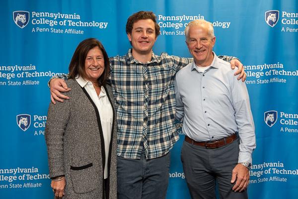 Making a memory with Mom and Dad! Kade N. Chrostowski, applied management, from Moorestown, N.J., receives the Penn College Visiting Chef Scholarship.