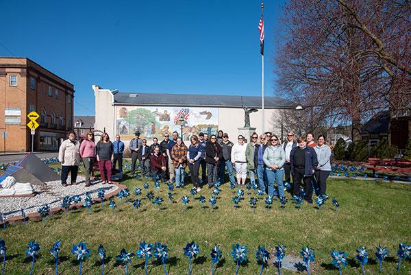 Following the planting of 700 pinwheels at the Jersey Shore Veterans Park, a group photo
