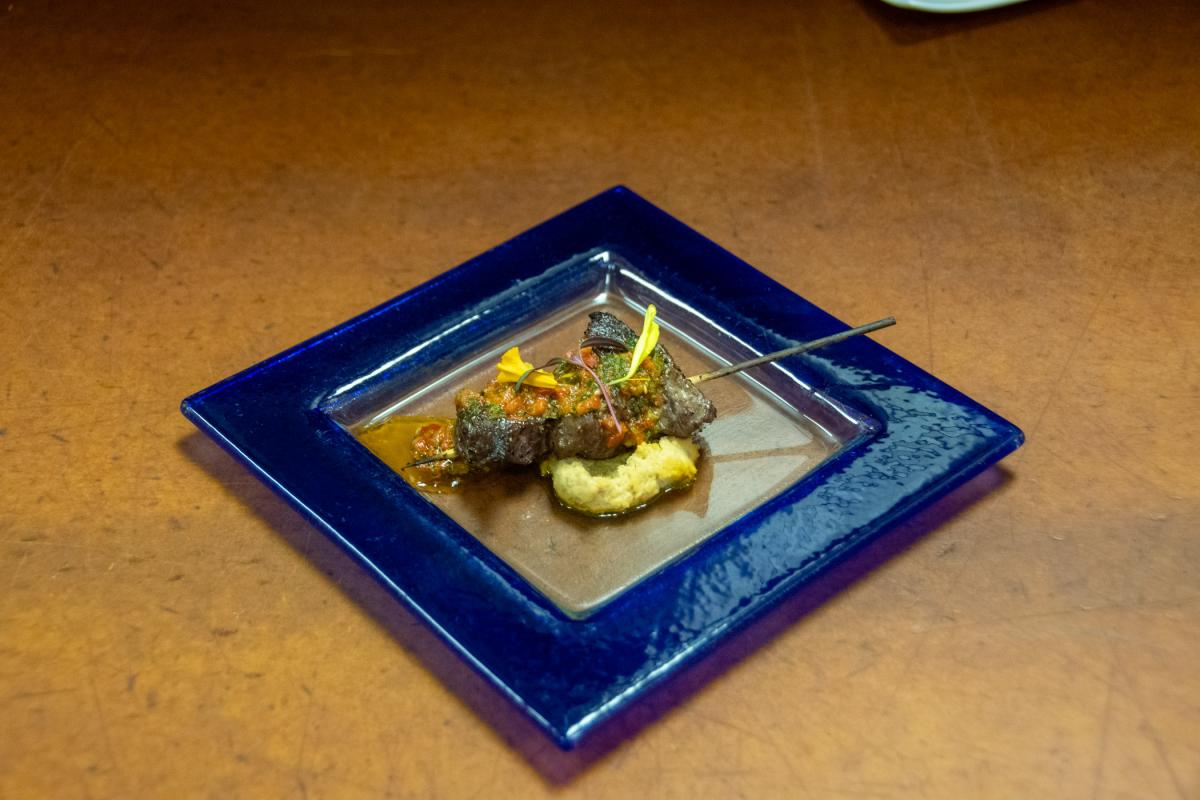 Passed to guests during a pre-dinner reception: Lamb spiedini (skewer) with hummus and adjika sauce