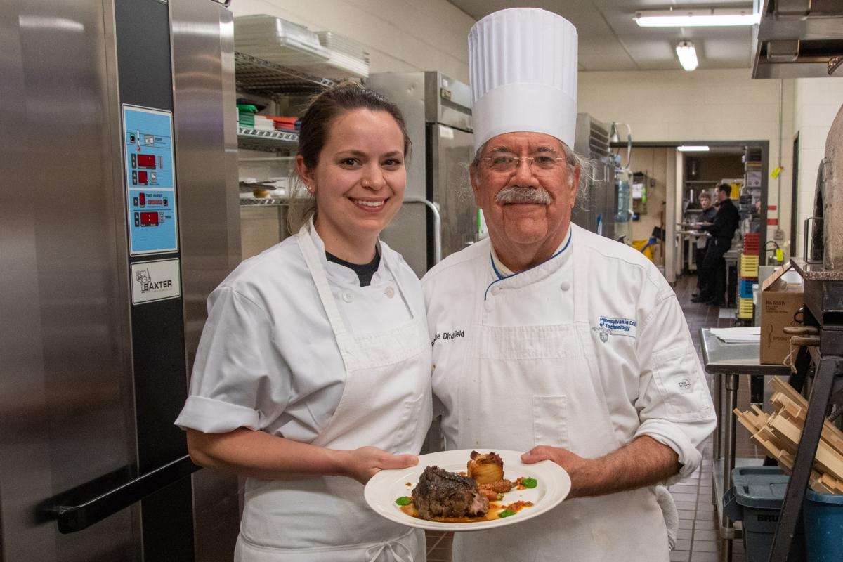 Commemorating the final plate off the line at his final Visiting Chef Dinner, Ditchfield – who will retire following the spring semester – captures the memory with his former student.