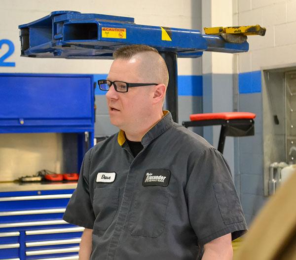 David Guild, service technician at Blaise Alexander Chevrolet of Muncy, answers a student's question about how work is distributed among technicians. He earned two diplomas at Penn College in 2005: an associate degree in automotive technology and a bachelor's in automotive technology management.