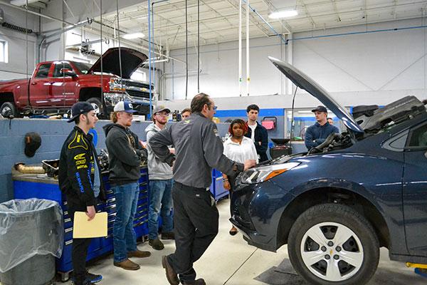 Joe Cordoni, service technician at Blaise Alexander Chevrolet of Muncy, explains a repair order on which he's working. Cordoni has been part of the Blaise Alexander corporate family for nearly three decades.