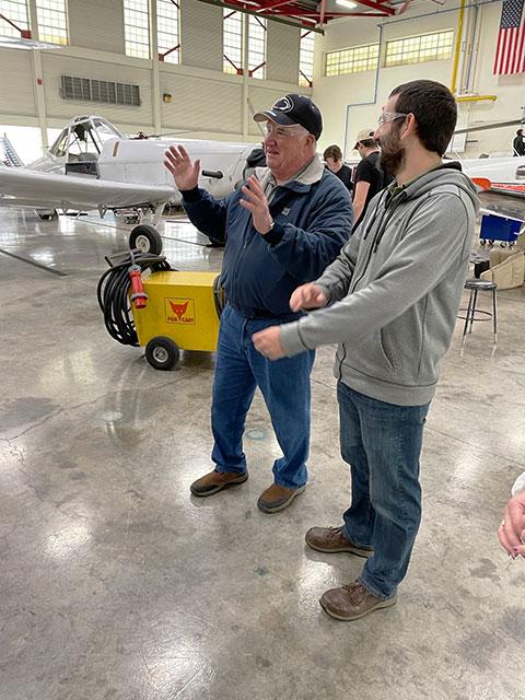 Gable talks with William F. Stepp IV, assistant professor of aviation maintenance ...