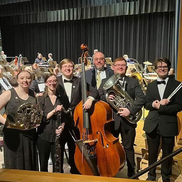 Geffre (third from left) with four Lycoming College festivalgoers and William Ciabattari (rear), associate professor and chair of Lyco's music department.