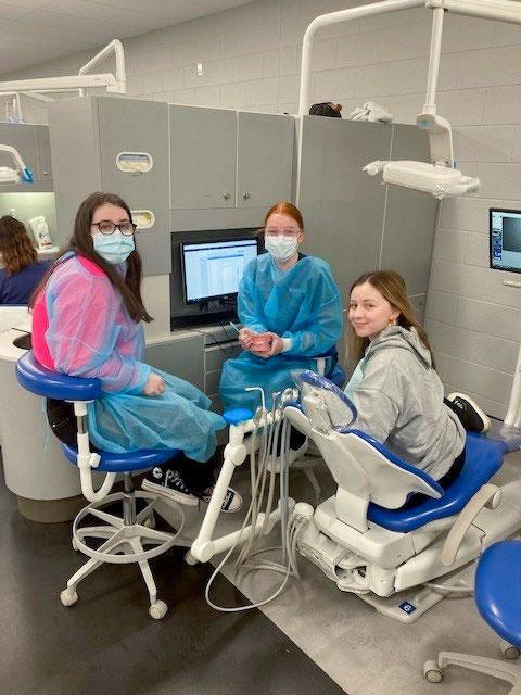 Alisha Catterson (left) observes real student-patient interaction in the Dental Hygiene Clinic with Penn College student Teagan A. Willey (center). Willey, of Towanda, is in her final semester of the dental hygiene associate degree. The patient is Alexa M. Tupper, an undecided student from Montoursville.