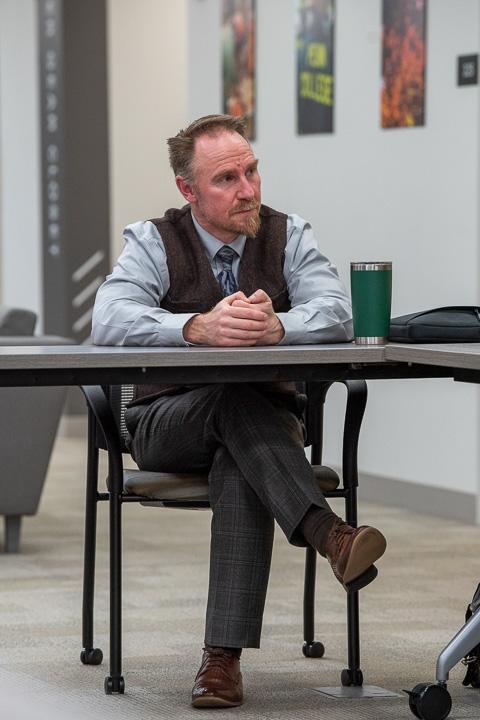 John F. Chappo, assistant professor of history/history of technology, thoughtfully listens.