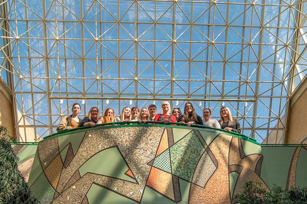 During their final day on campus, the Northern Ireland dozen captures a keepsake above the mosaic in the ATHS.