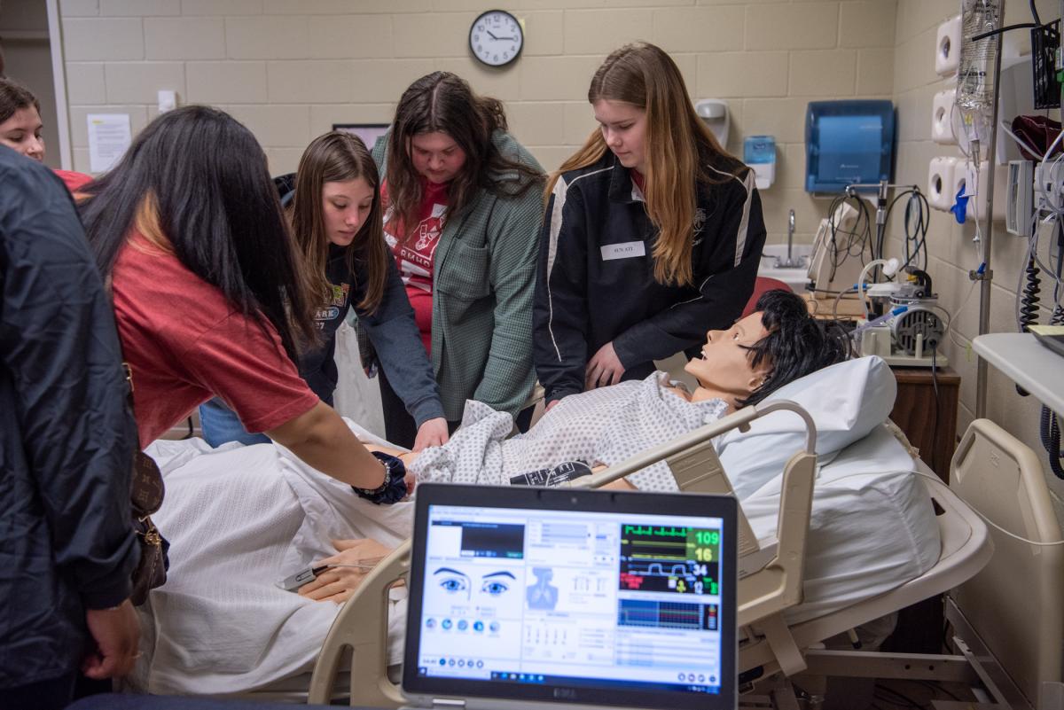 Visitors from SUN Area Technical Institute explore high-tech and high-touch in a Penn College nursing lab. 