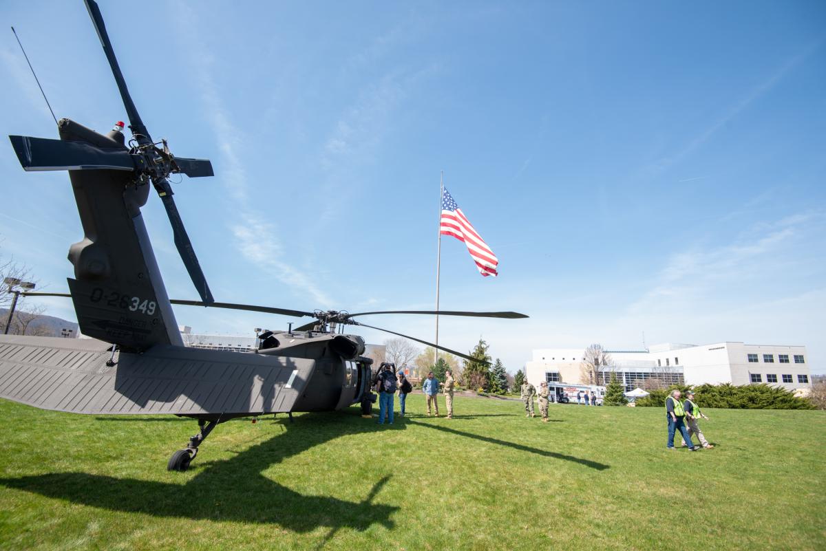 Beneath Old Glory, the magnitude and majesty of a Black Hawk helicopter graces the lawn of the Davie Jane Gilmour Center. 