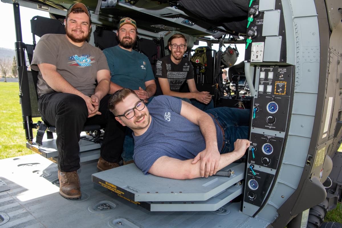 Welding & fabrication engineering technology students get an inside glimpse of one of the Black Hawk helicopters (seated from left): Stephen F. Goodwin, Ellicott City, Md.; Michael Patrick Fulton, Sykesville, Md.; and Ryan Thomas Blythe, Center Valley; and (reclining) Joel A. Henschel, Collegeville.