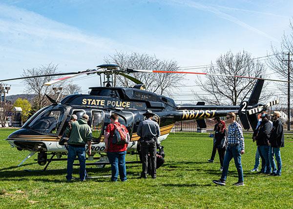 Spectators at Rotorfest enjoy some up-close exposure to a Bell helicopter operated by the Pennsylvania State Police. 