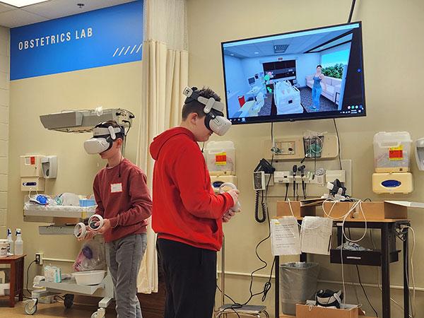 Young visitors take a VR spin through the hospital via a nursing simulator.