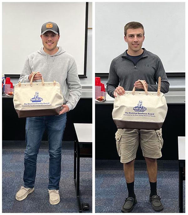 Adam L. Shaffer (left) and Jacob M. Reitz hold the canvas toolbags that were part of their prize packs.