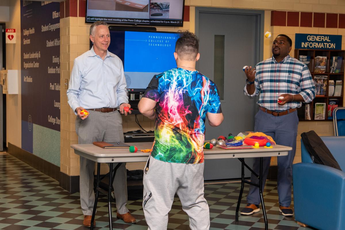 “President Mike” (left) and Woods enjoy juggling a wide range of campus assignments. 