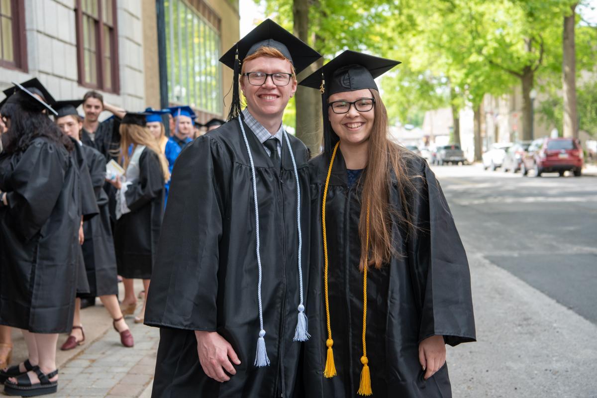 Accustomed to being behind the camera as student photographers, Frank T. Kocsis III and Alexis Burrell both graduated in graphic design.