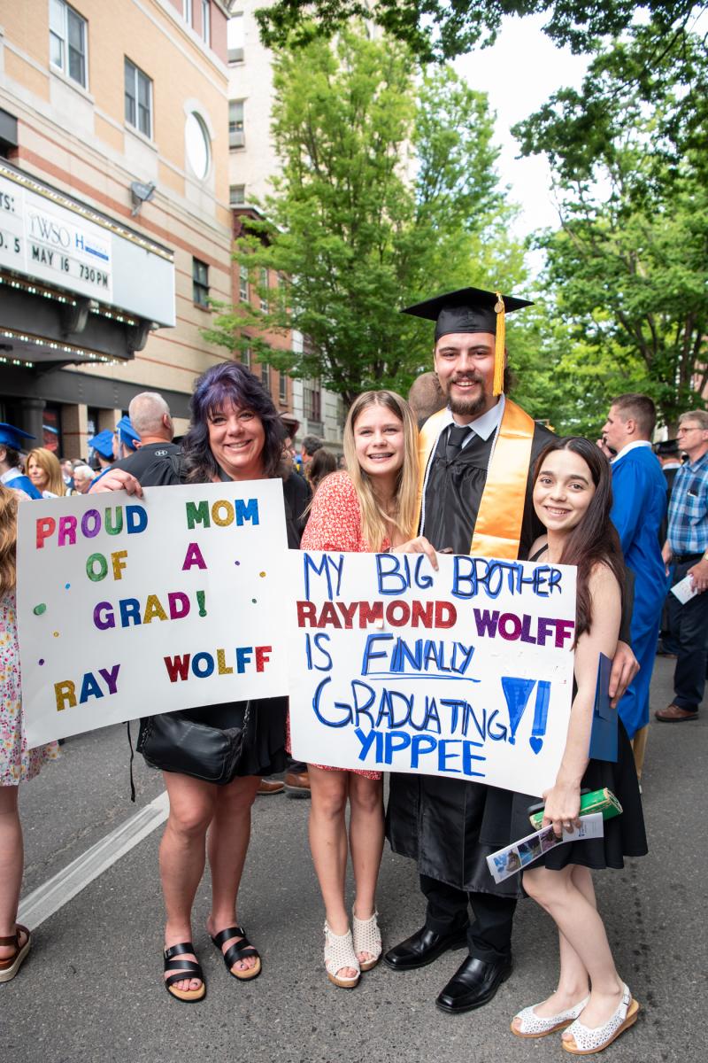 Raymond W. Wolff, building automation engineering technology, celebrates with his mother, sister and fiancée. 