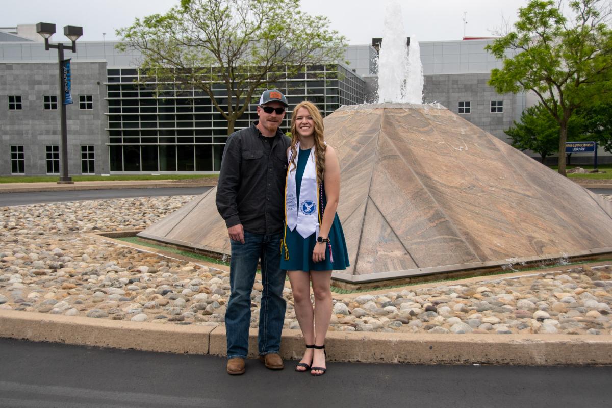 Penn College archer and new welding & fabrication engineering technology grad Cierra N. Beatty poses with her fiancé, Colby Lahn, for a traditional pic in front of the main-entrance fountains ...