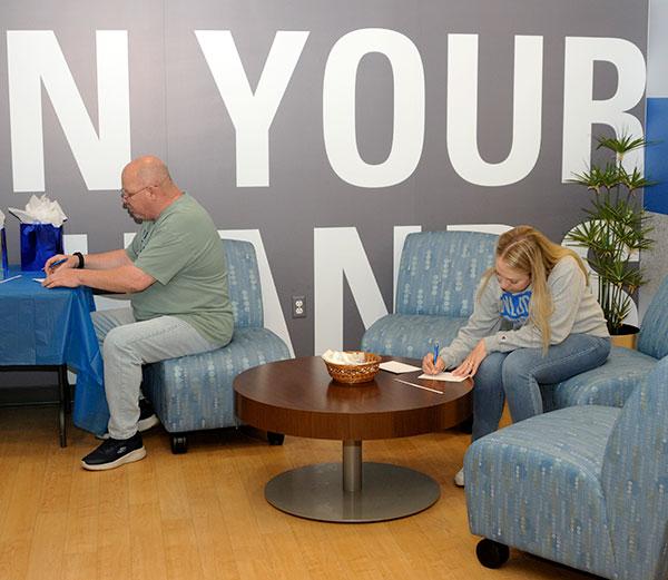 Chet Beaver, the college’s coordinator of veteran and military services, and Katie Burke, veteran services specialist, add their personal touch to student correpondence ...