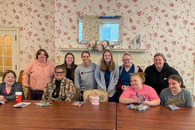 Dental hygiene students join staff and clients at YWCA Nothcentral PA. Standing (starting second from left) are Amanda G. Muehlbauer, of Greentown; Hope E. Weber, of Lock Haven; Mikayla R. Miller, of Sligo; Cameryn Sock, of Elysburg; and Kaytlyn J. Reitenbach, all slated to graduate May 12.