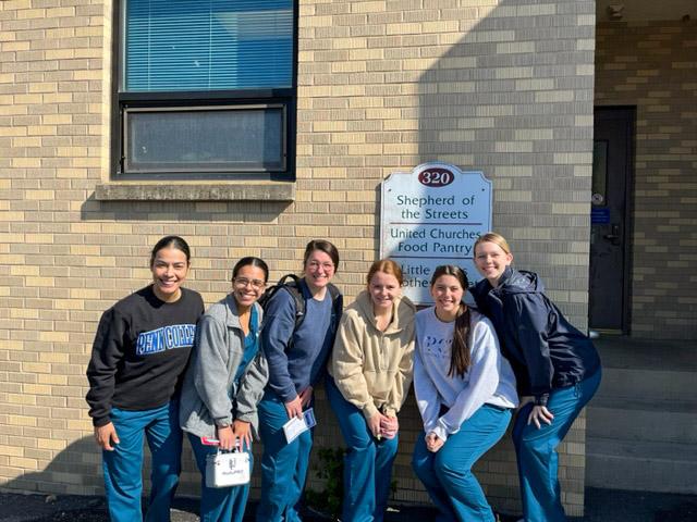 Pausing outside the office of Shepherd of the Streets are dental hygiene students Lorena Super of Port Matilda; Ninoshka M. Rivera Matos, of Lebanon; Kate H. Snyder, of State College; Chelsey L. Streich, of Williamsport; Sabrina Giordano, of White House Station, N.J.; and Cassidy J. Hasenmayer, of Sellersville.