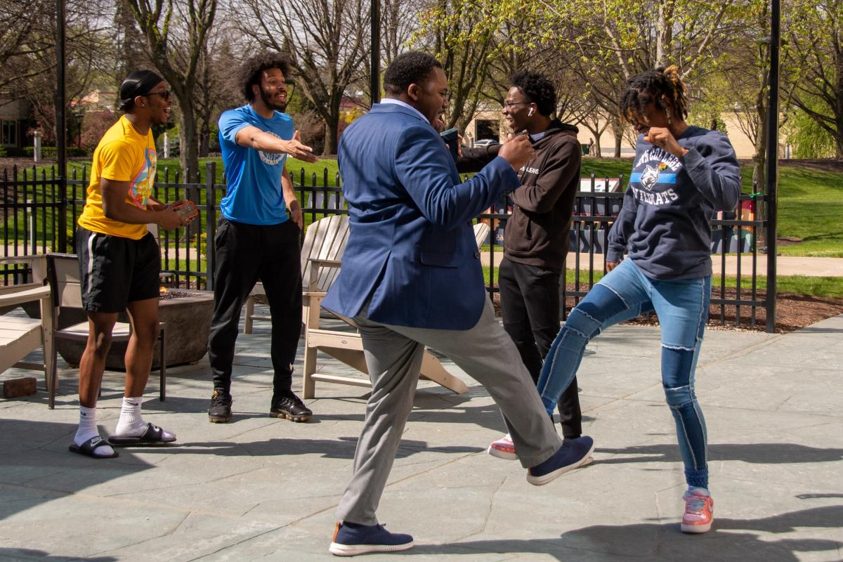 While a DJ plays, Nate Woods Jr., special assistant to the president for inclusion and transformation, and Love break out the Kid ‘n Play ...