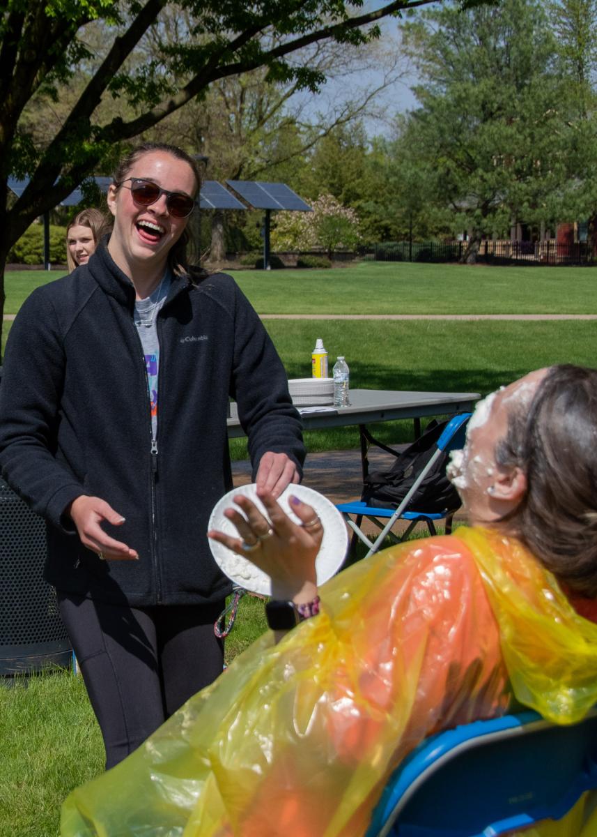 Bukeavich gets a laugh out of her pie-in-the-face from Ashley Rich.