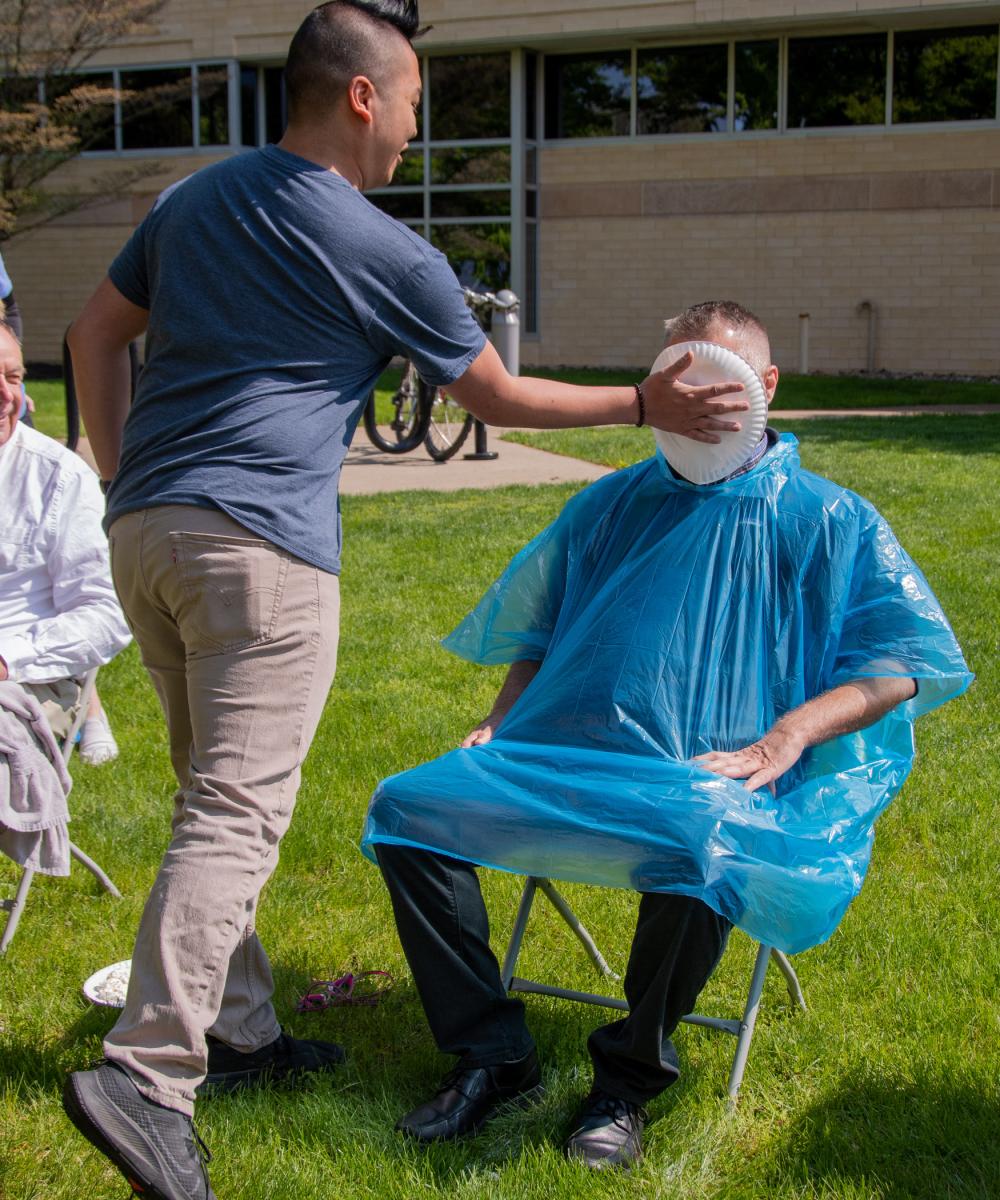 Just before class, Cheskiewicz takes a pie from Theodore R. Hernandez, a network administration & engineering technology student from Pottstown.