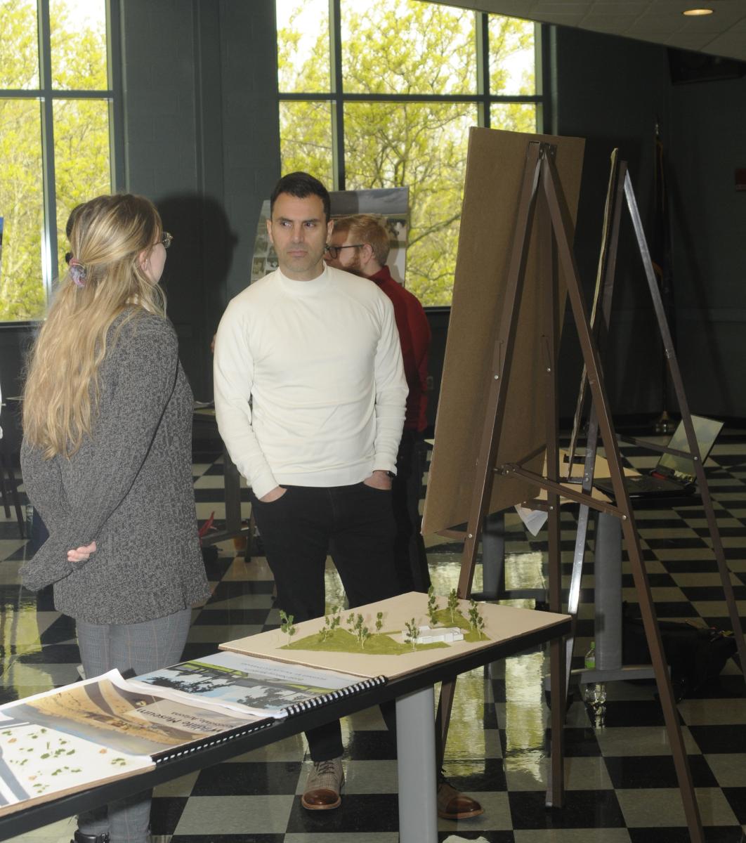 Naim N. Jabbour, assistant professor of architecture, and Kaitlyn G. Hillenbrand, of Harrisburg, review her plans for the Boise (Idaho) Nature Museum. 