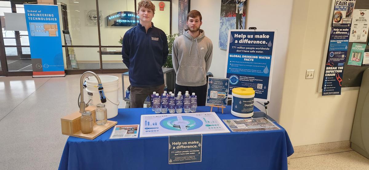 Spreading the word at another highly visible locale – outside the Keystone Dining Room – are construction management students Peter C. Thorbahn (left) of Devon, and Kamron J. Bertie, of Allentown.